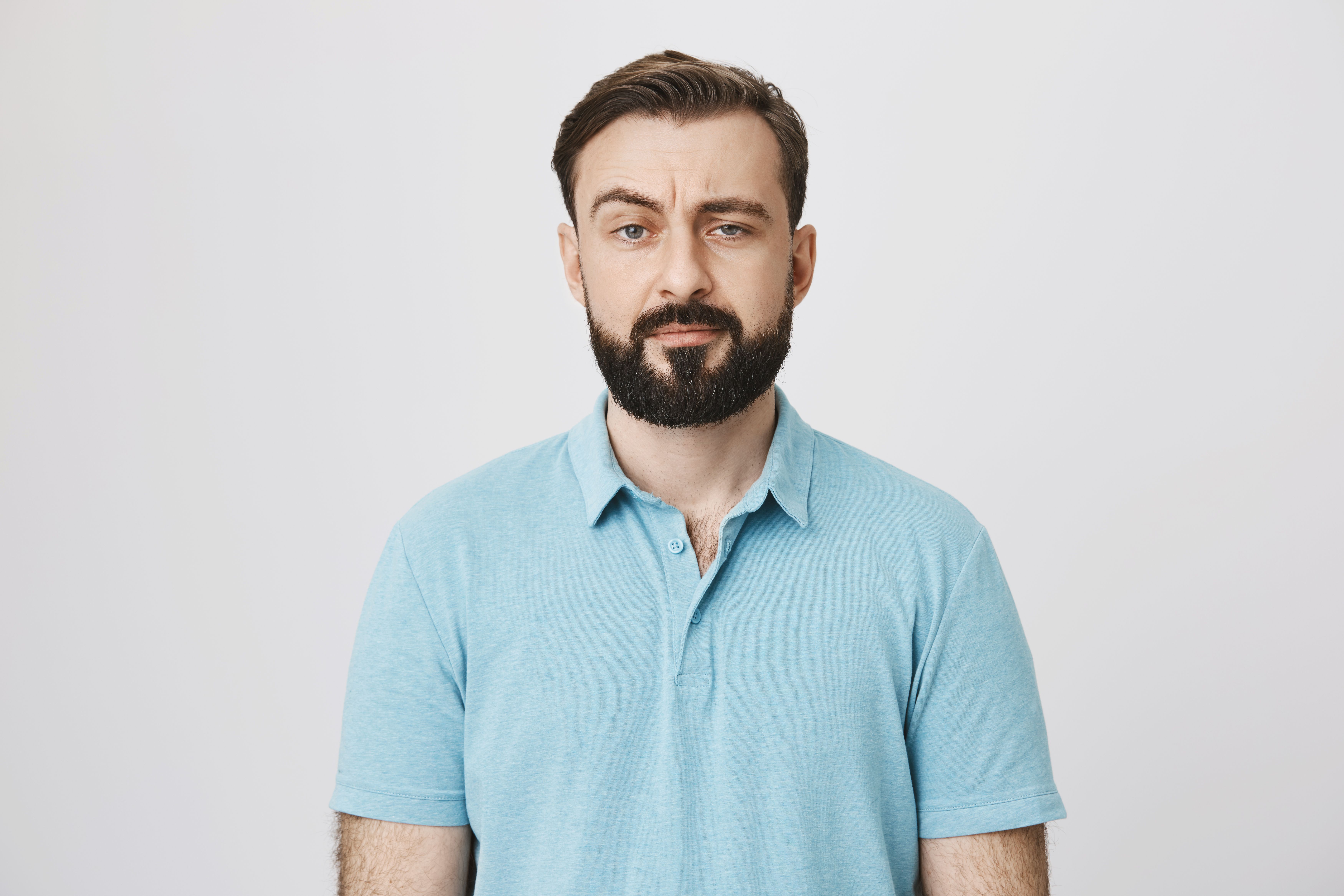 skeptical unamused bearded guy staring doubtful